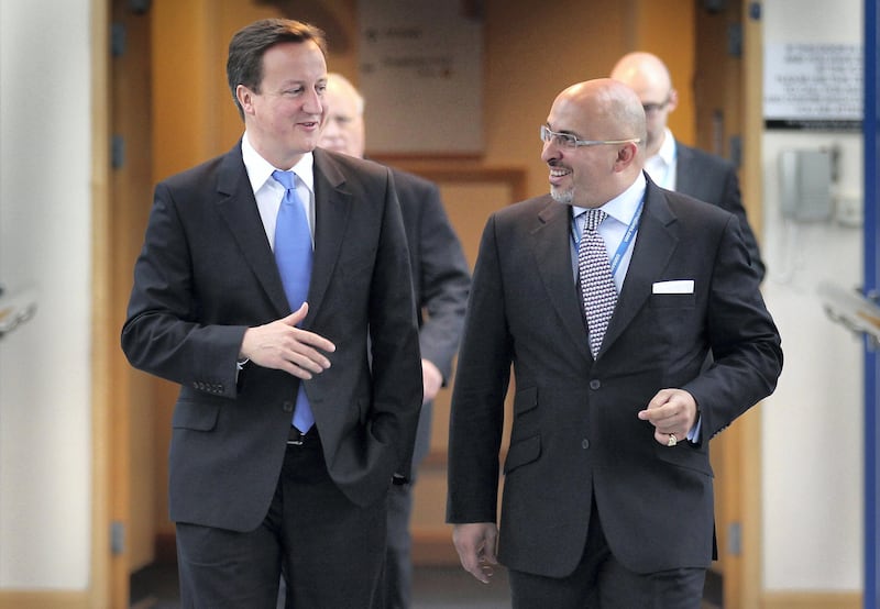 BIRMINGHAM, ENGLAND - OCTOBER 05:  Prime Minister David Cameron (L) walks with Conservative MP Nadhim Zahawi at the Conservative Party Conference during a television interview on October 5, 2010 in Birmingham, England. On the third day of the conference speakers are set to debate public services, crime and justice and poverty.  (Photo by Peter Macdiarmid/Getty Images)