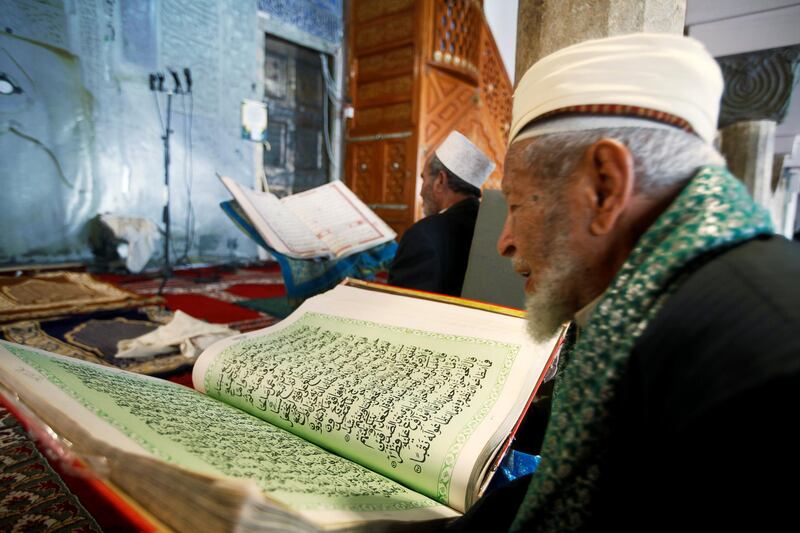 A man reads the Quran at the Grand Mosque ahead of the holy month  in Sanaa. Reuters