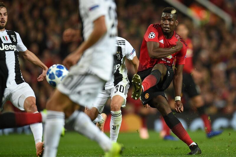 Manchester United's French midfielder Paul Pogba hits the post with this shot during the Champions League Group H  match against Juventus at Old Trafford. AFP