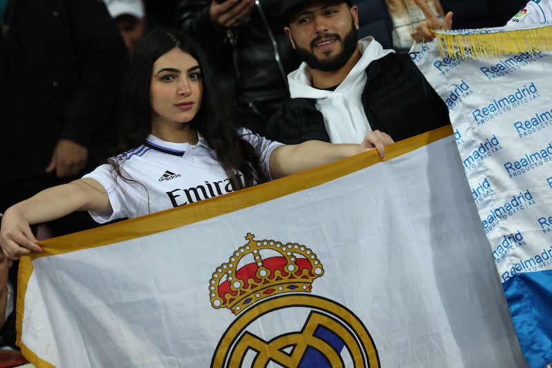 Real Madrid supporters hold a flag before kick-off at the Prince Moulay Abdellah Stadium. AFP