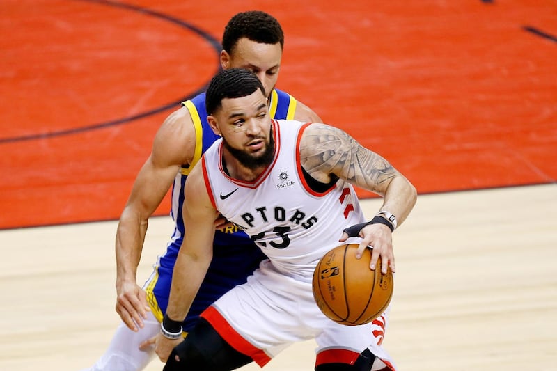 Toronto Raptors guard Fred VanVleet (23) dribbles while defended by Golden State Warriors guard Stephen Curry. USA Today