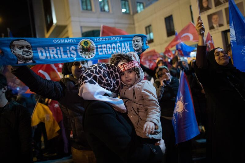 Supporters of Justice and Development Party (AK Party) hold a banner featuring the picture of Turkish President Recep Tayyip Erdogan as they wait for results in the Istanbul mayoral race in the local election in Istanbul. EPA
