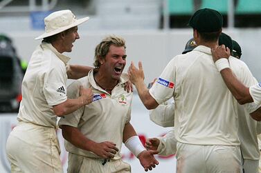 (FILES) In this file photograph taken on March 28, 2006, Australian bowler Shane Warne (C) celebrates with teammates after bowling out South Africa's batsman Andre Nel on the final day of the second Test match between South Africa and Australia at Sahara Stadium Kingsmead in Durban.  - Australia cricket great Shane Warne, widely regarded as one of the greatest Test players of all time, has died of a suspected heart attack aged 52, according to a statement from his management company on March 4, 2022, Warne's management said the retired leg-spinner died in Koh Samui, Thailand.  (Photo by ALEXANDER JOE  /  AFP)