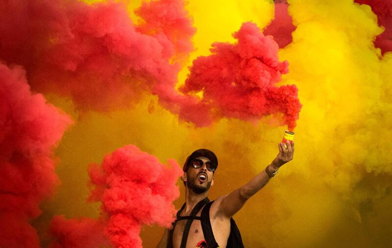 An Esperance supporter celebrates a goal during the CAF Champion League final 2019 1st leg football match between Morocco's Wydad Athletic Club and Tunisia's Esperance sportive de Tunis in Rabat.  AFP