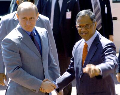 Vladimir Putin is greeted by Infosys chairman Narayana Murthy during a visit to the company's headquarters in Bengaluru, India, on December 5, 2004. Infosys played down its ties in Russia on March 25, 2022 after Rishi Sunak came under fire over his wife's stake in the IT giant. AFP