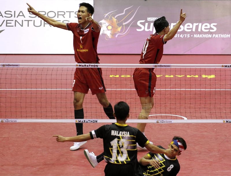Thailand’s players celebrate winning a set against Malaysia during their mens final match. Asia Sports Ventures / Action Images via Reuters