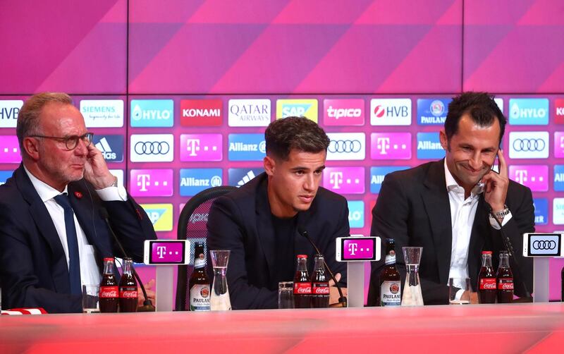 Bayern Munich CEO Karl-Heinz Rummenigge, left, and sporting director Hasan Salihamidzic, right, alongside new signing Philippe Coutinho at the Allianz Arena, Munich, Germany. Reuters