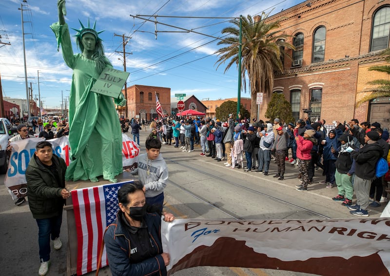 Several hundred people marched through the streets of El Paso a day before President Joe Biden's first visit to the southern border. AP