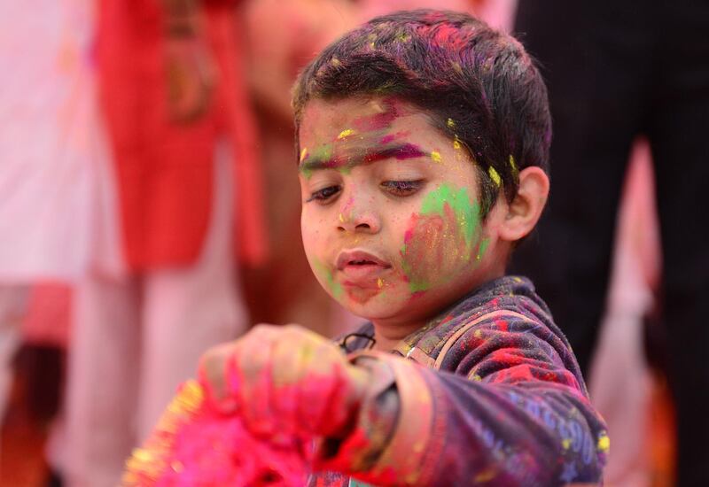 A child suffering from cerebral palsy celebrates Holi, the spring festival of colours, during an event organised by the Trishla Foundation, a non-profit organisation for cerebral palsy treatment, in Allahabad on March 6, 2020. AFP