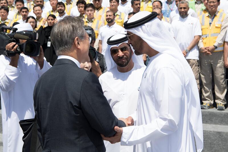 AL DHAFRA, ABU DHABI, UNITED ARAB EMIRATES - March 26, 2018: HH Sheikh Mohamed bin Zayed Al Nahyan Crown Prince of Abu Dhabi Deputy Supreme Commander of the UAE Armed Forces (R), HE Moon Jea-In, President of South Korea (L) and HH Sheikh Hamdan bin Zayed Al Nahyan, Ruler’s Representative in Al Dhafra Region (C), attend the Unit One Construction Completion Celebration at Barakah Nuclear Energy Plant. Seen with Emirates Nuclear Energy Corporation employees. 

( Abdullah Al Junaibi )
---