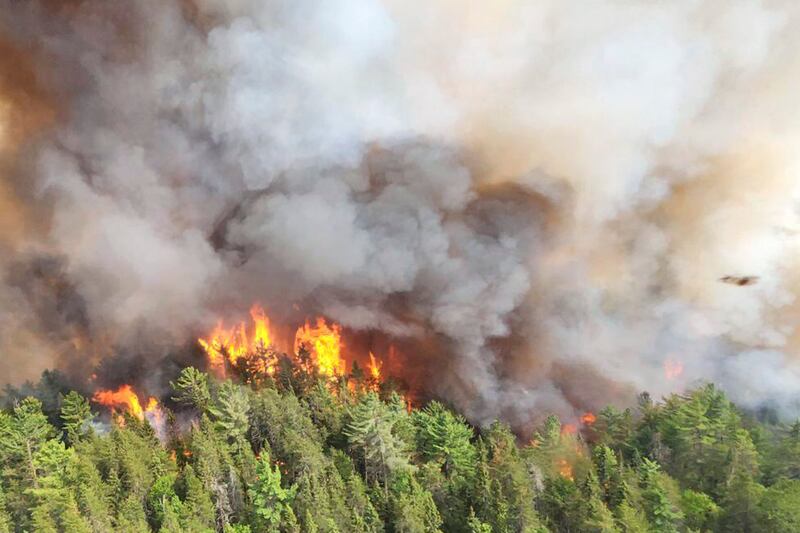 A wildfire burns east of Mississagi Provincial Park near Elliot Lake, Ontario. AP