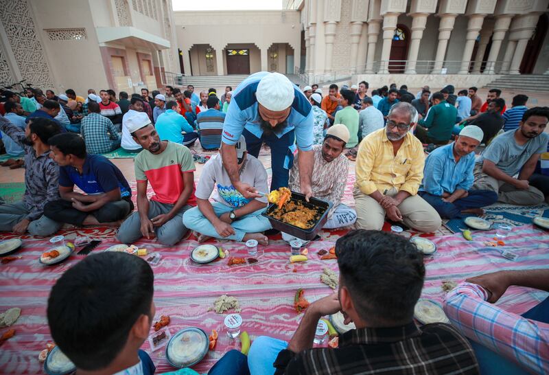 Iftar is served at Mary Mother of Jesus Mosque. Victor Besa / The National