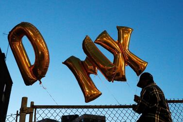 A fan attaches balloons during a vigil for musician and actor DMX outside White Plains Hospital, where it is reported he is being warded following a heart attack during a drug overdose, in White Plains, New York, U.S., April 6, 2021. REUTERS/Brendan McDermid