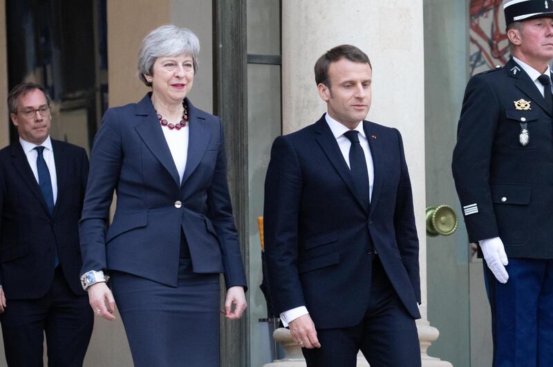Emmanuel Macron, France's president, and Theresa May, U.K. prime minister, exit from Elysee Palace following a meeting in Paris, France, on Tuesday, April 9, 2019. May is visiting Berlin and Paris today as part of her efforts to win a short delay to Britain’s departure from the European Union, while at home some in her Conservative Party try to throw her overboard. Photographer: Christophe Morin/Bloomberg