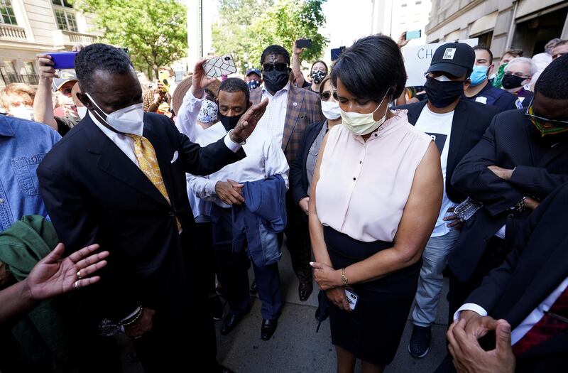 Washington, DC Mayor Muriel Bowser bows her head in prayer during a vigil as protests continue on the streets near the White House over the death in police custody of George Floyd, in Washington, U.S. REUTERS