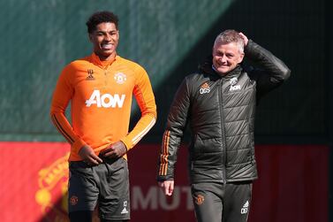 Marcus Rashford chats to Manchester United manager Ole Gunnar Solskjaer during a first team training session. Getty