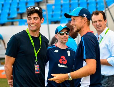 Alastair Cook (L) and Joe Root (R) of England chat during a training session one day ahead of the 2nd Test between West Indies and England at Vivian Richards Cricket Stadium in North Sound, Antigua and Barbuda, on January 30, 2019. / AFP / Randy Brooks
