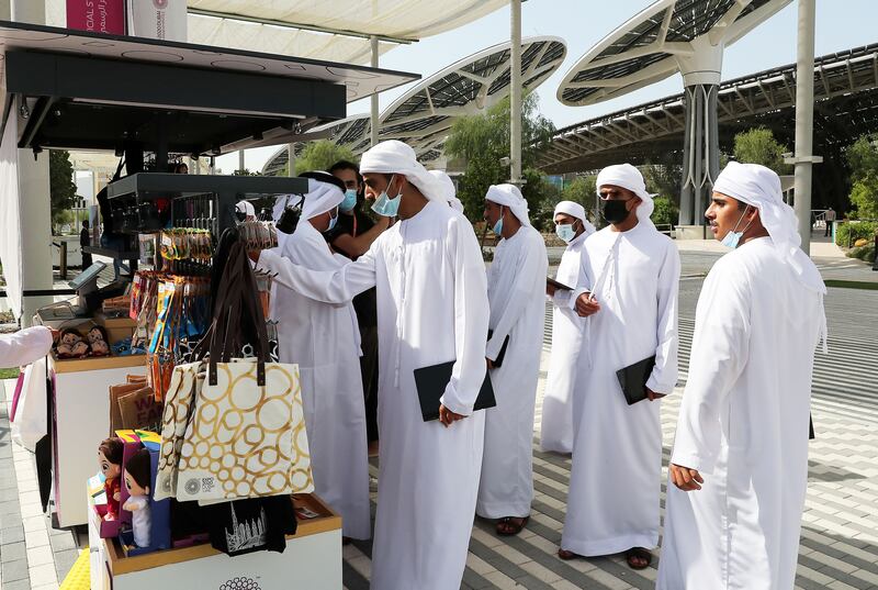 Visitors hunt for souvenirs at one of the Expo kiosks.