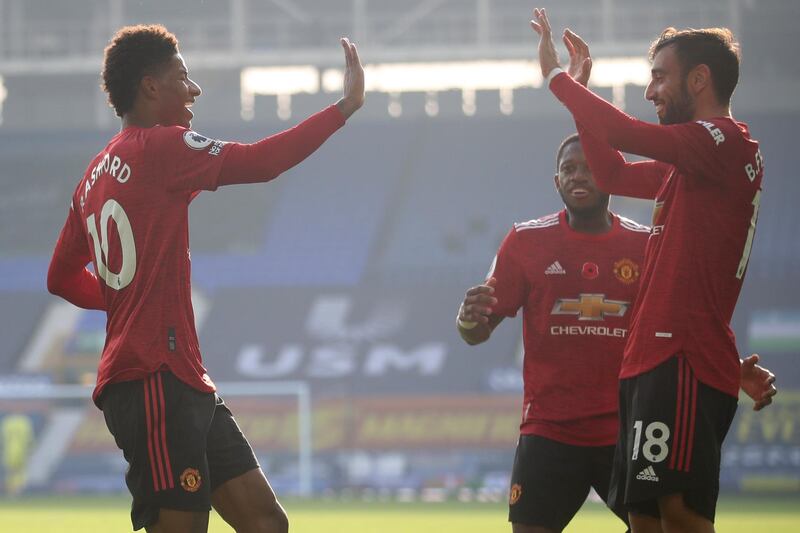 Manchester United's Bruno Fernandes, right, celebrates after scoring his side's second goal at   Goodison Park on Saturday. AP