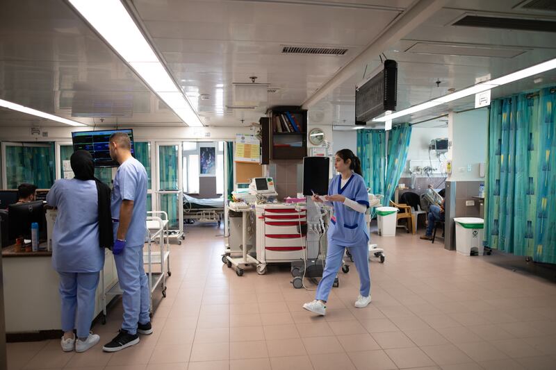 Nurses at work in the cardiac care unit of the hospital. 

