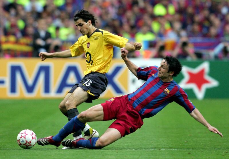 PARIS - MAY 17:  Francesc Fabregas (L) of Arsenal is challenged by Mark Van Bommel (R) of Barcelona during the UEFA Champions League Final between Arsenal and Barcelona at the Stade de France on May 17, 2006 in Paris, France.  (Photo by Shaun Botterill/Getty Images)