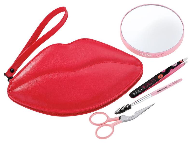 The brow set features a slant tweezer, brow shaping scissors and brush, a 10x mirror and a lip-shaped cosmetic bag