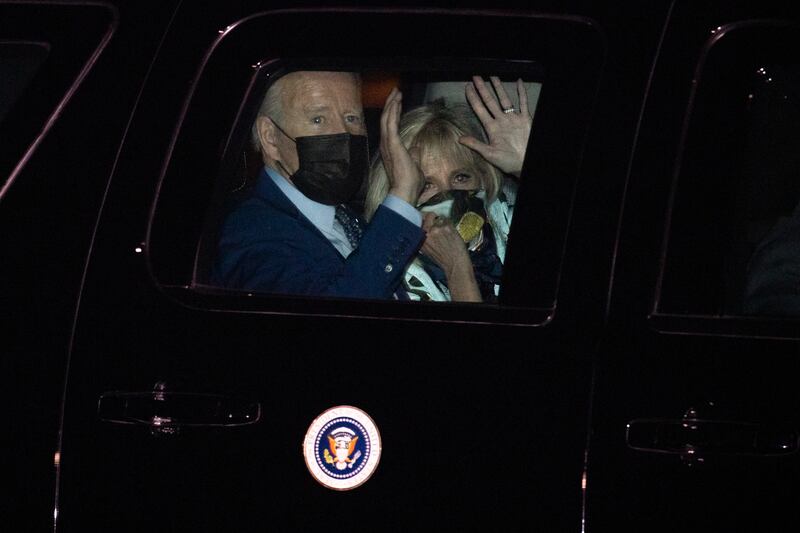 Mr Biden and the first lady are driven away following their arrival at the White House on April 29. EPA