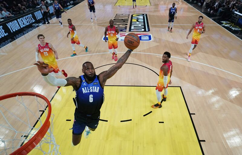 Team LeBron forward LeBron James dunks during the first half of the NBA basketball All-Star game in Salt Lake City. AP