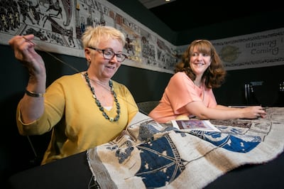 Tapestry experts work on the 77-metre-long tapestry, currently on display at the Ulster Museum - Game of Thrones Tapestry Exhibition.