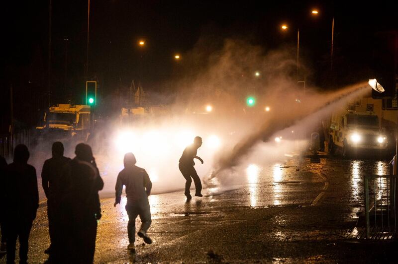 Nationalist youths clash with police on the Springfield Road. EPA