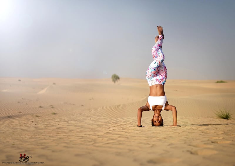 Diana Azavedo, director of the yoga teacher training courses at Zen Yoga Dubai, performs a headstand. Courtesy Diana Azavedo