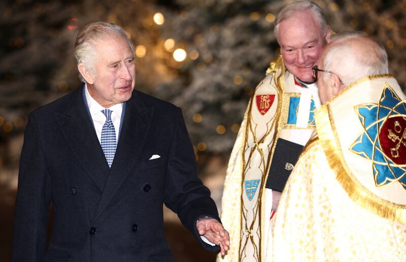 Britain's King Charles III talks with Dean Hoyle at the Together at Christmas carol service. Reuters