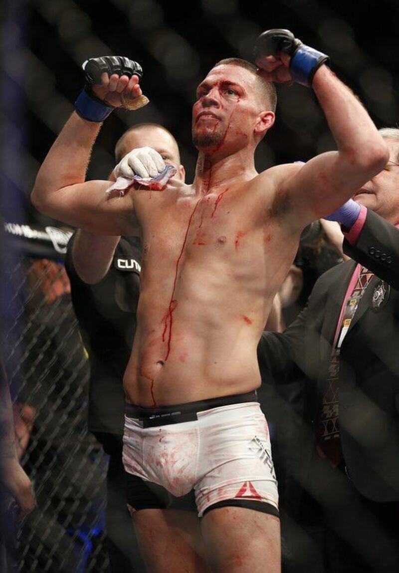 Nate Diaz, left, celebrates his second -ound submission victory over Conor McGregor during their UFC 196 welterweight mixed martial arts match Saturday, March 5, 2016, in Las Vegas. (AP Photo/Eric Jamison)