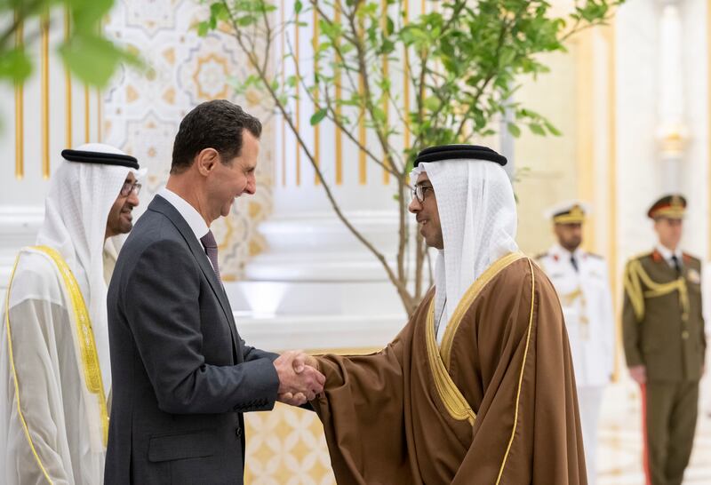 Sheikh Mansour bin Zayed, Deputy Prime Minister and Minister of the Presidential Court, greets Mr Al Assad at Qasr Al Watan. Presidential Court
