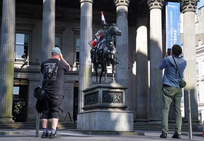 The Duke of Wellington statue outside the Gallery of Modern Art in Glasgow, with its new-look traffic cone – which is not the work of Banksy. PA 