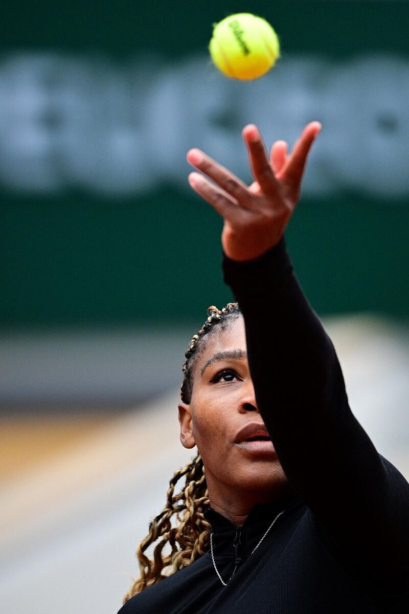 Serena Williams serves the ball to Kristie Ahn. AFP