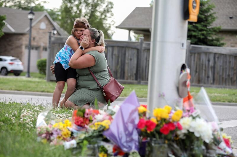 Misty Santerre and her daughter Jasmina visit the scene in London, Ontario, Canada, where a man driving a pick-up jumped the kerb and ran over a Muslim family in what police are calling a hate crime. Reuters