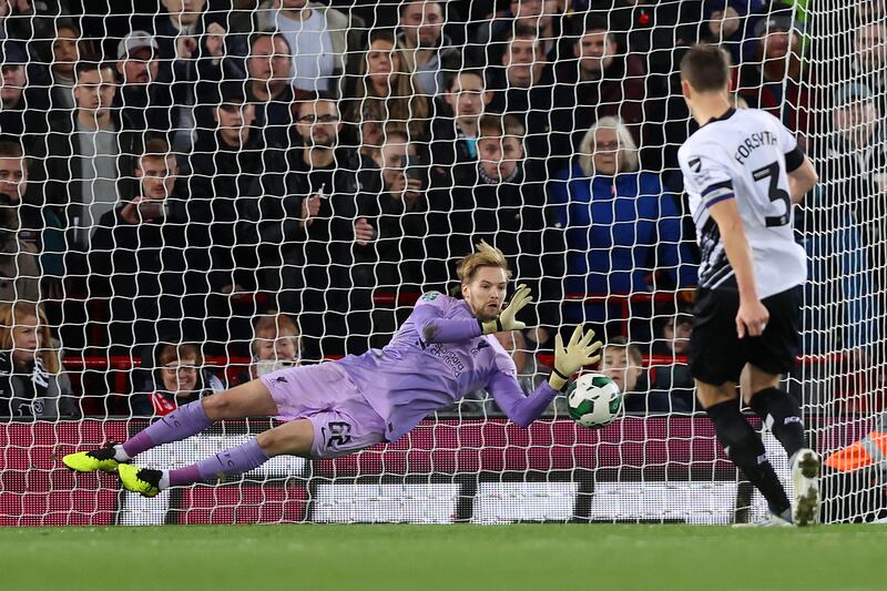 Caoimhin Kelleher saves a penalty from Derby's Craig Forsyth. Getty