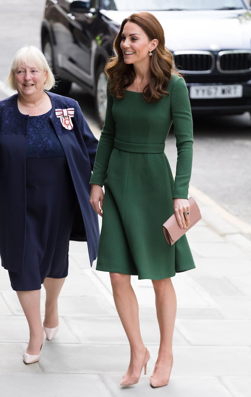 The Duchess of Cambridge wears a green Emilia Wickstead dress with a a Mulberry Amberley clutch bag, Gianvito Rossi Praline 85 Pumps and Kiki McDonough jewellery to open the Anna Freud Centre on May 1. EPA
