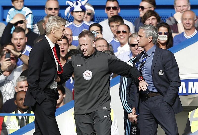 Chelsea's Portuguese manager Jose Mourinho, right, and Arsenal's French manager Arsene Wenger. AFP