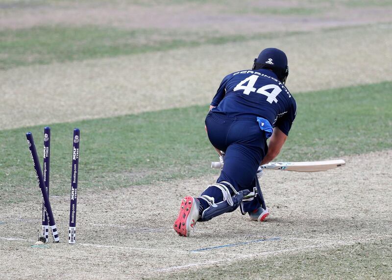 Dubai, United Arab Emirates - October 30, 2019: Richie Berrington of Scotland is bowled by the UAE's Rohan Mustafa during the game between the UAE and Scotland in the World Cup Qualifier in the Dubai International Cricket Stadium. Wednesday the 30th of October 2019. Sports City, Dubai. Chris Whiteoak / The National