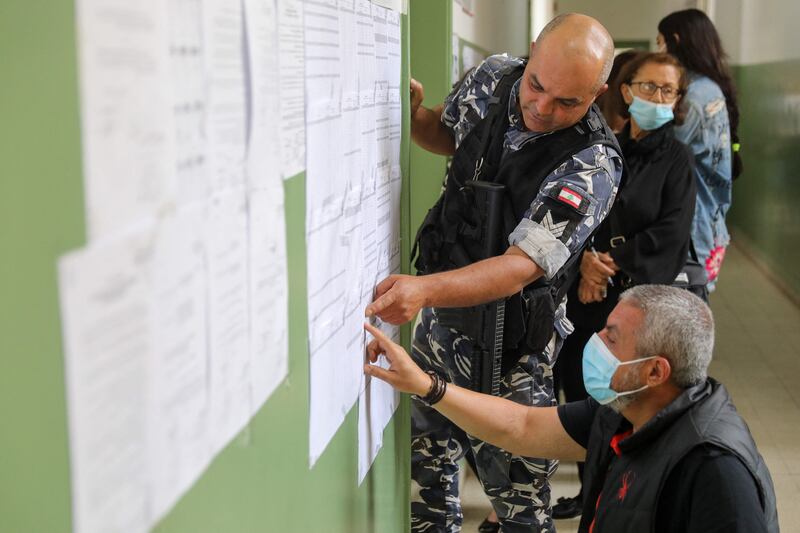 A voter checks lists for the parliamentary election at a polling station in the Lebanese capital Beirut. AFP