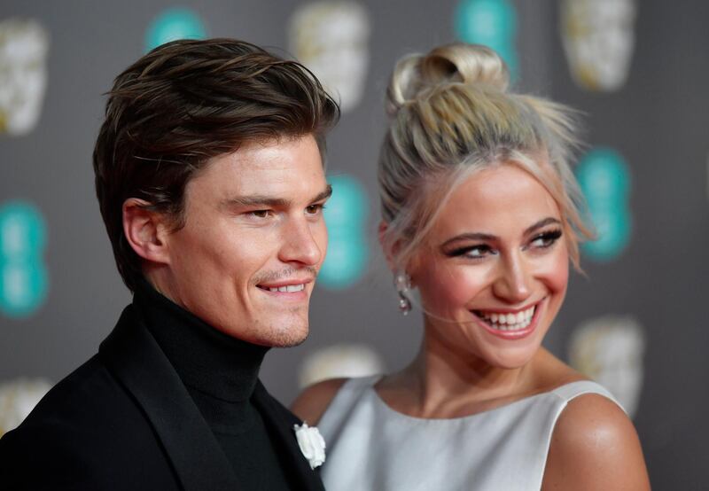 Pixie Lott and Oliver Cheshire arrive at the 2020 EE British Academy Film Awards at London's Royal Albert Hall on Sunday, February 2. Reuters