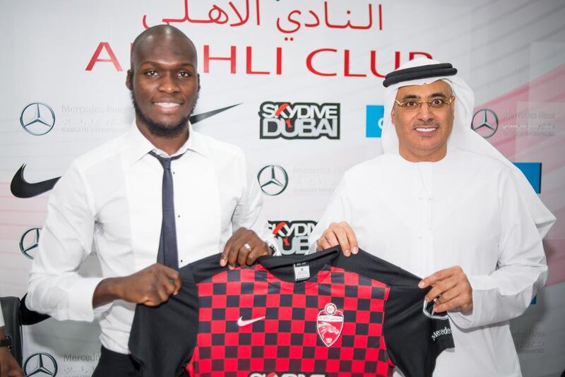 Al Ahli’s new signing Moussa Sow, left, was introduced by the club’s chief executive Ahmed Khalifa in Dubai on Wednesday. Alex Atack for The National

