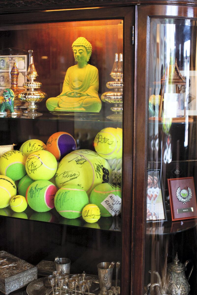 In the run up to the Wimbledon tennis championship reporter Tim Stickings and I visited and interviewed locals to guage the feeling ahead of the competition. Many local businesses create elaborate window displays to celebrate the tennis, one of the best we saw was at the Thai Tho restaurant complete with signed tennis ball shrine watched over by a Buddha statue.