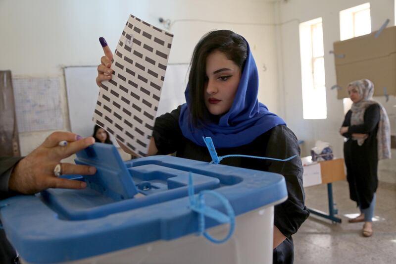 A Kurdish woman in traditional clothes prepares to vote during the Kurdistan parliamentary election at a polling station in Erbil, the capital of the Kurdistan Region in Iraq. With over three million people eligible to vote, the semi-autonomous region is voting on its parliamentary elections a year after a failed bid for independence from Iraq.  EPA