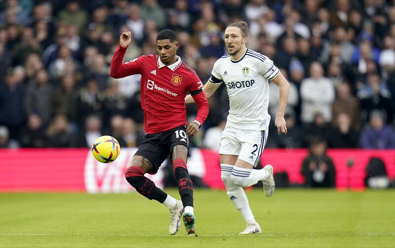 Manchester United's Marcus Rashford and Leeds United's Luke Ayling compete for the ball. PA