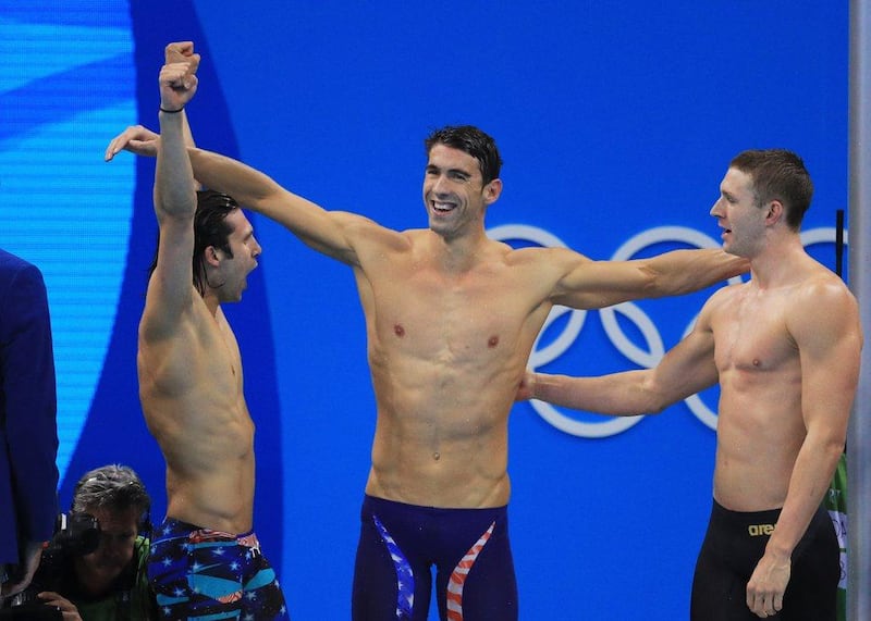 Swimmer Michael Phelps would always performs three arm swings on the starting block before every race, wrapping his 6'7" wingspan around him for a #MPBackslap. Getty