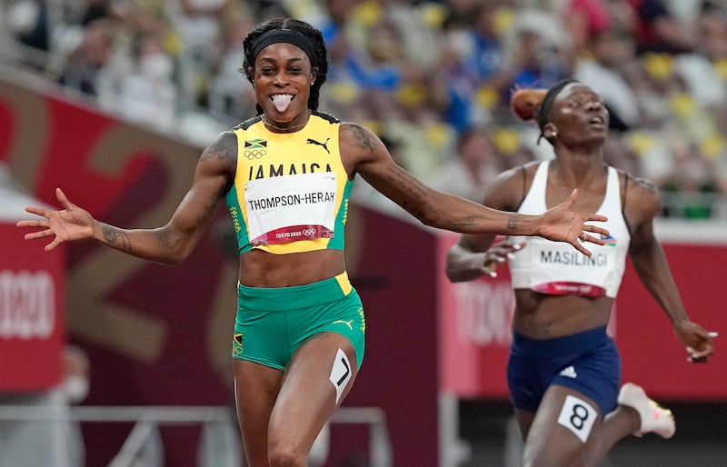 Elaine Thompson-Herah celebrates after winning the gold medal in the women's 200m at the Tokyo Olympic Games.
