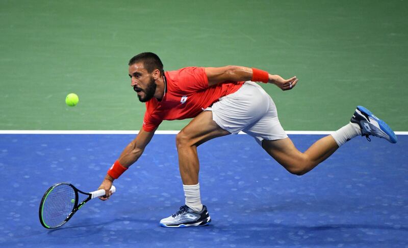 Damir Dzumhur hits the ball against Novak Djokovic on day one of the 2020 U.S. Open tennis tournament at USTA Billie Jean King National Tennis Center.  Robert Deutsch-USA TODAY Sports